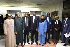 NDIC Executive Director, Operations Mr. Mustapha M. Ibrahim (2nd Left) and ICPC, Acting Director System Study and Review, Mr. Olusegun Adigun (3rd Left) pose for a group photograph during the inauguration of the NDIC Anti-Corruption and Transparency Unit (ACTU) at the NDIC headquarters in Abuja. They are pictured alongside (L to R) NDIC Director Enterprise Risk Management Department, Mrs. Amal Haruna, Director Communication and Public Affairs Department, Mr. Bashir A. Nuhu, ICPC Assistant Director, Hajia Mutiat Musa, NDIC Director Internal Audit Department, Mr. Idongesit Essien, ICPC Desk Officer overseeing the NDIC, Barr. Adebimpe Abodunrin and Chairman of the NDIC ACTU, Dr. Bashir Mande.