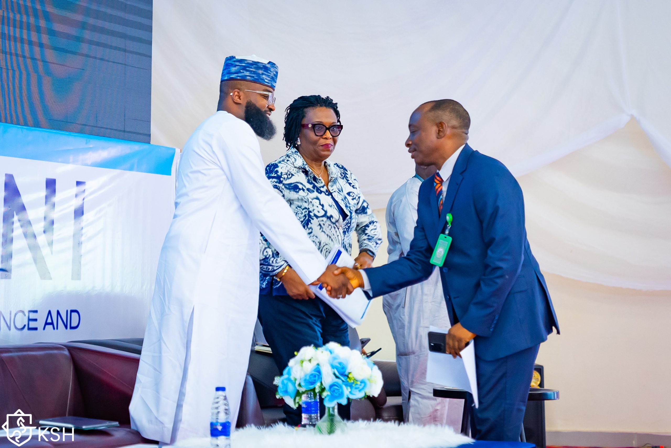 EVC/CEO, National Agency for Science and Engineering Infrastructure (NASENI), Mr. Khalil Suleiman Haliu in a warm handshake with a participant at the workshop