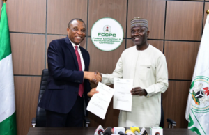 From Left: Executive Vice Chairman/CEO, Federal Competition and Consumer Protection Commission, Dr. Tunji Bello and Executive Vice Chairman/CEO, Nigerian Communications Commission, Dr. Aminu Maida, during the Memorandum of Understanding (MoU) signing ceremony between the two regulatory agencies for increased telecom consumer protection in Abuja on Tuesday January 14, 2025).