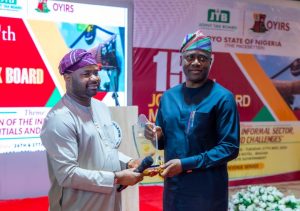 Chairman, Federal Inland Revenue Service, Zacch Adedeji, presenting a plaque to Governor Seyi Makinde of Oyo State at the opening of the 157th Board meeting on the Joint Tax Board(JTB) held at the JAG hotel , Ibadan, Oyo State