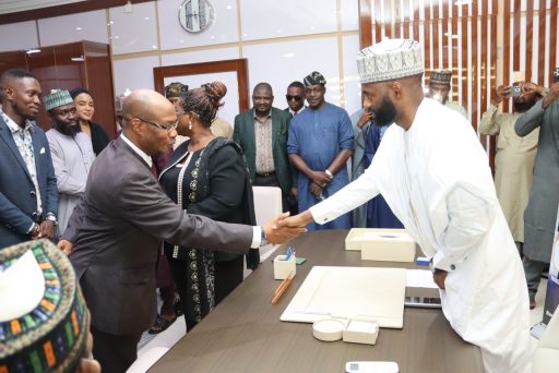 NAIC new MD/CEO, Mr Yazid Shehu Danfulani (right) in a handshake with another government dignitary during a reception organised to mark his official resumption of official in Abuja on Tuesday, May 27, 2025.