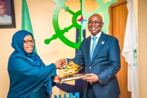 Director General, Nigerian Maritime Administration and Safety Agency, NIMASA, Dr Dayo Mobereola (right) presenting a souvenir to the Head of the Delegation/Vice Chairman of the Tanzania Shipping Agencies Corporation, TASAC, Rukia D. Shamte during a study visit by TASAC to the NIMASA headquarters in Lagos