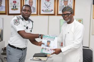 L-R: National Public Relations Officer of the Service, Assistant Comptroller of Customs Abdullahi Maiwada presenting a souvenir to renowned artificial intelligence strategist and digital consultant Celestine Achi, author of "AI-Powered PR: The Essential Guide for Communications Leaders to Master Artificial Intelligence," 