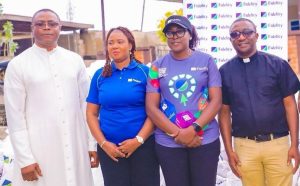 L-R: Church Administrator, St. Patrick Catholic Church, Ado-Ekiti, Reverend Benedict Joseph; The Branch Leader, Fidelity Bank Plc, Ado-Ekiti, Mrs. Ikeolu Akinropo; Team Lead CSR, Fidelity Bank Plc, Victoria Abuka; and Fidelity Food Bank Partner, Reverend Michael Domingo, at the Fidelity Food Bank distribution event held in Ekiti recently.