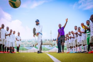 The Executive Vice Chairman/CEO of the National Agency for Science and Engineering Infrastructure (NASENI), Mr. Khalil Suleiman Halilu (middle) kicks a ball to signal the opening of the NASENI Games 2025 at the MKO Abiola Stadium, Abuja yesterday.