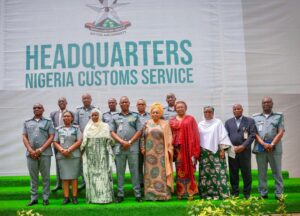 CGC of Customs, Bashir Adewale Adeniyi flanked by Director General of NAPTIP, Binta Adamu (L) and a former Director in NIMASA, Hajia Lami Tumska (R), joined by some senior Customs officers and other delegates from NAPTIP