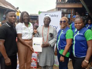 L-R: Proprietor, Part of Solution , Makoko, Prince Shemede Taiwo; Team Lead, CSR, Fidelity Bank Plc, Victoria Abuka; Traditional Leader of Makoko Community, Shemede Emmanuel Ajaka; Head, HR Business Partnerships & Communication, Fidelity Bank Plc, Nwamaka Kalu; and Class Governor, Achievers’ Inductees Class, Fidelity Bank Plc, Oluwabusayo Obagunwa, during the Fidelity Helping Hands Program (FHHP) outreach and donation of food items and other relief materials to residents of Makoko, Lagos.