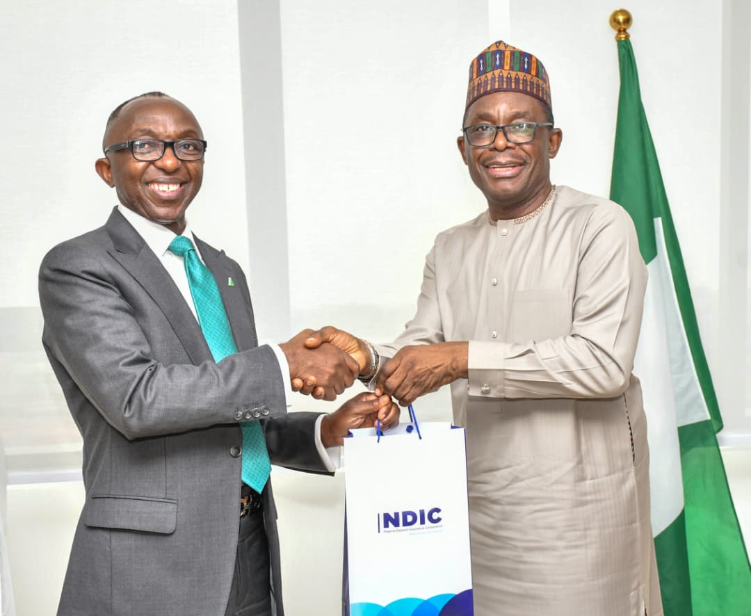 L-R MD/CE, Ministry of Finance Incorporated (MOFI), Dr Armstrong Takang, receives NDIC publications as a gesture of goodwill and collaboration between the two organizations. The publications were presented by the MD/CE NDIC, Mr. Thompson Oludare Sunday, during NDIC’s courtesy visit to MOFI in Abuja