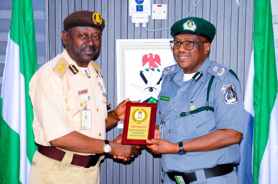 (R-L) Customs Area Controller (CAC), Kebbi Area Command, Comptroller Mahmoud Matawalle Ibrahim, fdc , received the newly posted Comptroller of the Nigerian Immigration Service (NIS), Kebbi State Command, Comptroller Mohammed Lawal Hayatuddeen, during a courtesy visit to the command headquarters on Thursday, 29 January, 2025