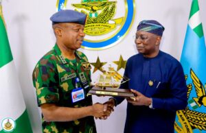 Director General, Nigerian Maritime Administration and Safety Agency, NIMASA, Dr Dayo Mobereola (right) presenting a souvenir to the Chief of Air Staff, Air Marshall S. K. Aneke during a courtesy visit by the NIMASA Director General to the Nigerian Air Force Head quarters in Abuja