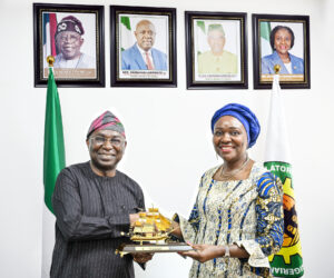 Director General, Nigerian Maritime Administration and Safety Agency, NIMASA, Dr. Dayo Mobereola (left) presenting a souvenir to the Commission Chief Executive, Nigerian Upstream Petroleum Regulatory Commission, NUPRC, Mrs. Oritsemeyiwa Eyesan during a working visit by the NIMASA Director General to the NUPRC corporate headquarters in Abuja.