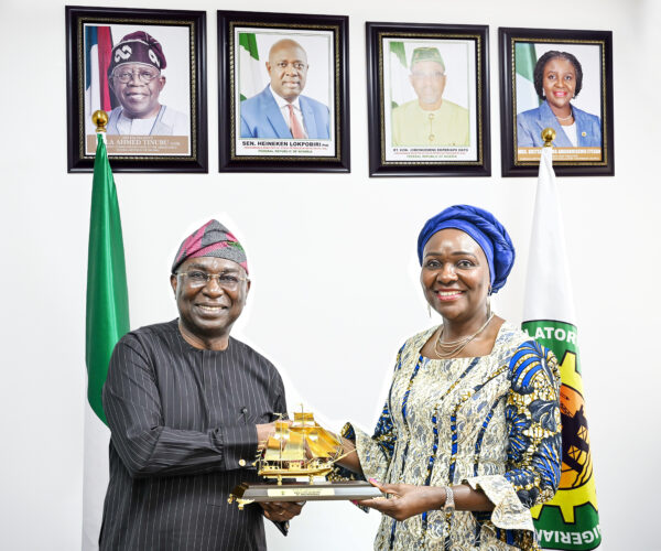 Director General, Nigerian Maritime Administration and Safety Agency, NIMASA, Dr. Dayo Mobereola (left) presenting a souvenir to the Commission Chief Executive, Nigerian Upstream Petroleum Regulatory Commission, NUPRC, Mrs. Oritsemeyiwa Eyesan during a working visit by the NIMASA Director General to the NUPRC corporate headquarters in Abuja.