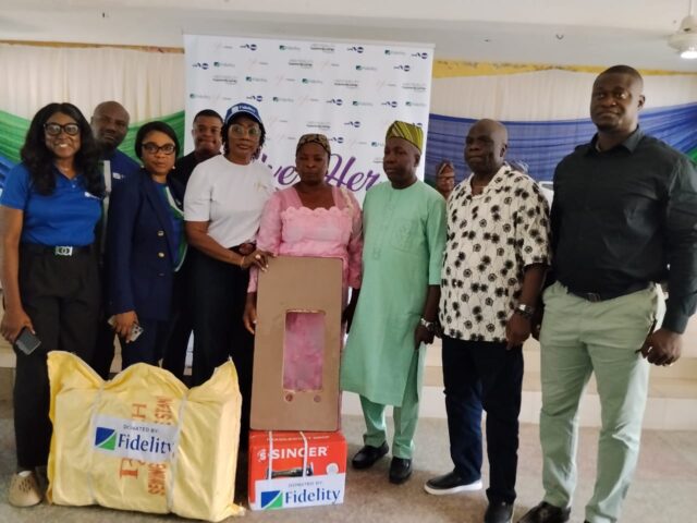 L-R: Team Lead, CSR, Fidelity Bank Plc, Victoria Abuka; Retail Team Rep., Fidelity Bank Plc, Stanley Ogbuze; Branch Leader, Fidelity Bank Plc, Adeola Odeku Branch, Ifeyinwa Asomugha; Public Sector Team Rep., Nnaemeka Ike; Head, Women Banking, Fidelity Bank Plc, Harriba Harry-Pepple; a beneficiary, Mrs. Akinsanya Abeke; Executive Chairman, Imota LCDA, Hon. Benson Sunday Ayodele; Executive Chairman, Ikorodu West LCDA, Hon. Sulaimon Kazeem Olanrewaju; and Chairman, Ikorodu Local Government, Prince Adedayo Ladega, during the Fidelity Bank “Give Her Power Initiative” which held in Ikorodu, Lagos recently.