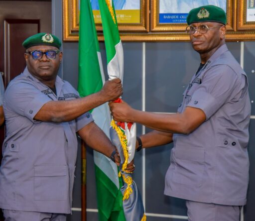 ACG Frank Onyeka handing over to Comptroller Joe Anani at the TinCan Island Port Command