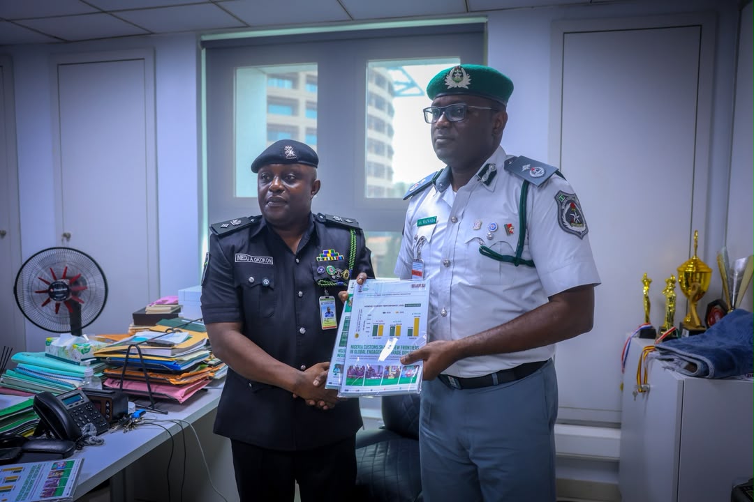 L-R: Force PRO, Chief Superintendent of Police (CSP) Anietie Okokon during a strategic visit to the NPRO of the NCS, Deputy Comptroller (DC) of Customs, Abdullahi Maiwada, on Monday, 13 July 2026, at the Service Headquarters, Maitama, Abuja.
