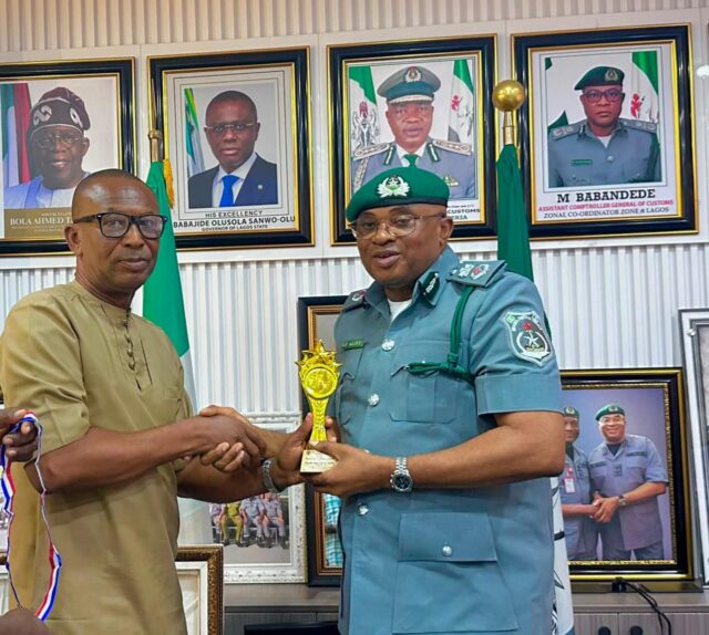 L-R: President, CONMMEP, Udo Onyeka presenting the award for Leadership Excellence and Trade facilitation to the Controller FOU Zone A, Comptroller Aliyu Gambo